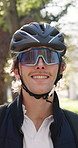 Face, man and courier with helmet outdoor for travel, commute and portrait for logistics service. Sunglasses, smile or delivery person at park, professional or gig worker with distribution in Germany