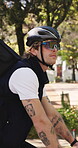 Delivery, bike or man in park with travel, bag or package export in eco friendly trip. Service, cycling helmet or person with parcel, bicycle commute or courier in sustainable transportation.
