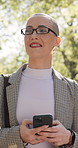 Businesswoman, walk and smile in park with phone, text message or morning commute for real estate job. Happy, female person and realtor thinking outdoor with digital tech, glasses and travel to work.