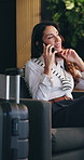 Woman, phone call and business trip in lounge at airport with smile, contact and communication on sofa. Mature person, smartphone and happy with talk for flight schedule, booking or travel in lobby
