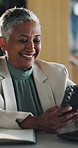 Woman, phone and texting with smile at office for review, insight or notification at insurance company. Mature person, happy and broker on smartphone for checklist, feedback or risk management agency