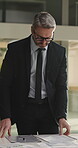 Review, glasses or man in office with document, budget or data analysis for funding pitch. Stats, specs or mature finance consultant with report, forecast or audit evaluation for investment proposal
