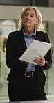 Documents, thinking and businesswoman in office with contract for finance investment deal. Planning, application form and mature female financial manager with approval for company budget paperwork.