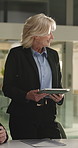 Tablet, presentation and businesswoman in office for discussion on finance forecasting on investment. Digital technology, meeting and mature financial manager with company asset prediction for budget