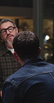 Night, meeting and business men in office for planning, collaboration and strategy for advertising. Marketing, startup and people in discussion for campaign review, feedback and teamwork for project