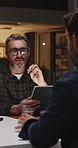 Night, people and talk in office with tablet, meeting or brainstorming ideas for marketing deadline. Late, manager and team in agency with tech, discussion and trend proposal for advertising project.