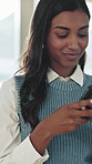 Woman, typing and text message in office with phone, check social media or email alert for business. Professional, female person and browse in workplace with tech, mobile app or online chat response.