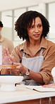 Pottery, women and teacher in workshop for feedback, help or learning process with craft guide. Ceramic class, creative studio and instructor with sculpture for art design, teaching technique or tips