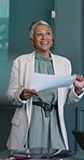 Documents, presentation and woman in office, planning for investment deal and report for profit. Mature person, financial advisor and paperwork for trading, conversation and speaker for economy info