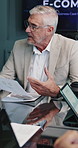 Meeting, documents and business man in boardroom for financial review, feedback and investment options. Office, team and workers in discussion for finance proposal, statistics and graphs for profit