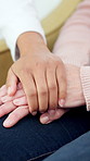 Support, holding hands and nurse with senior woman in retirement home for medical checkup. Healthcare, comfort and caregiver with elderly female patient for consultation in living room at house.