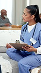 Nurse, clipboard and writing on sofa at retirement home with discussion, review and checklist for wellness. People, caregiver and admin for medical report, assessment and notes with elderly care
