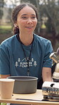 Outdoor, cooking and woman at summer camp, volunteer and explaining meal prep in nature and holiday. Happy, counselor and training session with portable stove, adventure and sustainable dining