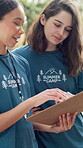 Team, clipboard and counselor at summer camp with conversation, schedule or help with agenda. Women, discussion and checklist for youth program with planning, advice or task delegation in nature park