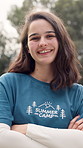 Happy, volunteer and face of woman at summer camp with confidence, crossed arms and pride. Forest, travel and portrait of counselor with smile for outdoor program, youth facility and holiday club