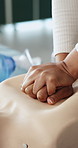 First aid, hands and person with dummy for cpr training for safety compliance in office. Medical demonstration, healthcare and employee with mannequin for emergency rescue for cardiac arrest.