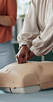 Hands, presentation and rescue with mannequin for cpr, teaching and gear at office. Person, coach and guide at workshop with dummy, chest compression or explain with first aid for emergency response