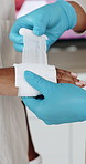 Hands, first aid and gloves with bandage at office, teaching and staff training with tutorial for help. Person, coach and cloth in workplace with gauze, learning and demonstration for emergency