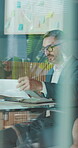 Meeting, documents and team with business man in office for budget, discussion and planning. Collaboration, revenue report and broker advisor with employees for account portfolio and proposal