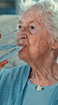Senior, woman or drinking with glass of water in home for hydration, nutrition or vitamins. Elderly, female person or mineral liquid with beverage for refreshing cleanse, detox or sustenance in house