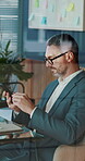 Reading, phone and glasses with business man in office for account manager, payroll review and research. Budget planning, tax audit and contact with mature person in agency for online project