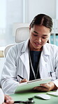 Doctor, consulting and tablet with woman in office for healthcare advice, medicine schedule and smile. Medical report, assessment and online referral with person in clinic for patient checkup