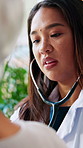 Doctor, old woman and stethoscope for assessment in home with cardiology exam for wellness in retirement. Medical professional, senior patient or consultation with equipment for elderly care in house