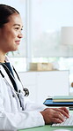 Computer, doctor and typing with woman in office for healthcare report, treatment plan and smile. Medical research, telehealth platform and online schedule with person in clinic for hospital review