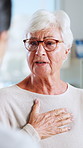Hospital, cough and doctor with senior woman in consultation, checkup and appointment. Healthcare, discussion and person with elderly patient for diagnosis, medical service and chest infection