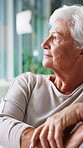 Planning, thinking and senior woman in home with nostalgia, memory or loneliness in living room. Sad, reflection and elderly female person in lounge with remember, daydreaming or emotions in house.
