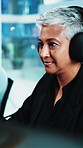 Smile, woman and reading with headphones in office for audio transcription, editing and draft review. Transcriber, mature person and tech at agency for playback software, proofreading and coworking