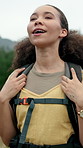 Happy woman, breathing or hiking with backpack in nature for fresh air, outdoor adventure or travel. Active, female person or hiker with stress relief on expedition for trekking journey or trip