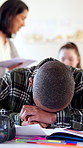 Disappointed, classroom and boy with test results for education fail, learning and mistake. Frustrated, school and upset student with burnout, stress and pressure for assignment, studying and exam