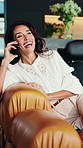 Laugh, phone call and woman on sofa in home with communication, contact or connectivity for gossip. Happy, relax and female person with cellphone on mobile conversation for catch up in living room.