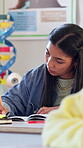 Education, girl student and writing in high school for lesson revision, exam preparation and notes. People, teenager and learning with books in class for study process, course info and academic essay