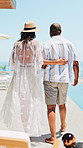 Walking, pool and couple with drinks at resort to celebrate marriage, anniversary and vacation together. Interracial, hotel and man with woman with champagne for bonding, love and travel for holiday