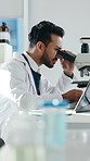 Man, scientist or laptop with microscope for medical research, exam or results in laboratory. Male person, checking and healthcare worker with scope for scientific examination or discovery in clinic