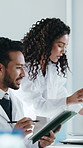 Scientist, tablet and discussion in laboratory with report, medical research and conversation. Biotech team, experiment review and people with digital tech for support, collaboration and feedback