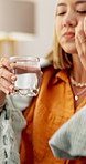 Woman, pills and drinking water for wellness in home with pharmaceutical supplement in morning. Person, glass and medicine with liquid, product and beverage for detox, gut health or benefits in house