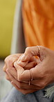 Nervous, thinking and hands with woman in home for trauma, anxiety or grieving perspective. Reflection, fear and stress with female person in living room of apartment for worry, crisis and mistake 