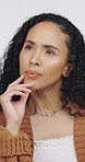 Thinking, makeup and woman in studio with ideas, decision or wonder with beauty, cosmetics or glow. Choice, health and person with planning for facial cosmetology by white background for self care.