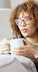 Coffee, relax and woman on sofa in home with aroma for caffeine, calm or peaceful on weekend. Cappuccino, morning and female person drinking warm beverage on couch in living room at apartment.