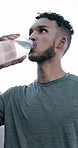 Man, drinking water and fitness in city with training, rest and hydration for wellness in morning. Person, runner and bottle for liquid, detox or gut health on break for exercise in urban town
