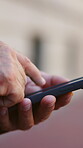 Texting, online and hands with phone in city, chat or communication with contact on social media app. Outdoor, employee and person with mobile for message, connection and networking with technology
