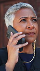 Angry, lawyer and woman in city with phone call for case schedule, mistake and discussion for legal trial. Courthouse, annoyed and person on cellphone talking for litigation, justice and negotiation