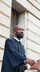 Man, judge and shaking hands with folder in city, greeting and ready for court case with documents. People, attorney and magistrate with paperwork, handshake and respect with legal career in town