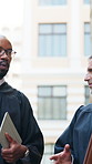 Lawyer, discussion and men in street, teamwork and advice for compliance review. Judge, collaboration or people in city, legal case planning and criminal investigation with consultation and support