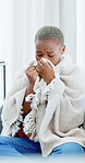 Sick, tissue and black woman with drink on sofa for recovery with cold, viral infection or sinusitis. Remedy, home and person with blanket, herbal tea and blowing nose for allergies, hayfever and flu