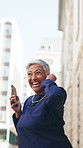 Phone, dancing and mature businesswoman in city with good news, achievement or finance project approval. Earphones, energy and female financial manager with groove for job promotion in urban town.