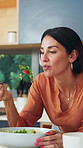 Eating, healthy food and woman with smile in kitchen, morning or nutrition for wellness in apartment. Happy, mature person and relax with salad in house, hungry and breakfast on weekend and meal